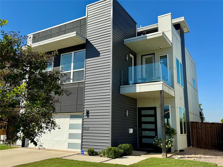 Experience a seamless mix of modern design and spacious comfort in this stunning open concept home filled with abundant natural light. Featuring tall ceilings and beautiful hardwood floors throughout, it creates a welcoming and luxurious atmosphere you'll love coming home to. This home includes numerous upgrades such as West Elm lighting in the kitchen and foyer, motorized power roller shades on most windows, pre-wired speakers throughout the house and on the third-floor rooftop terrace, an N’Finity Pro2 166-bottle built-in wine fridge, and indoor and outdoor lighting automation. The kitchen is a chef’s dream with all KitchenAid appliances, including a warming drawer, quartz countertops, and more. The master ensuite is exceptional, with an outdoor balcony, an oversized soaking tub, a walk-in shower, and a separate toilet room. The large walk-in master closet connects to the laundry room, making laundry time a breeze! Just when you think you’ve seen it all, there is another staircase leading to the third-floor rooftop terrace with views of downtown Dallas. You’ll be the perfect host with the Thor outdoor kitchen, which features a rotisserie grill, two-drawer refrigerator, outdoor sink, and more. This property stands out with its inviting features and prime location. Conveniently situated in Trinity Groves, just minutes from downtown Dallas and the Medical District, making it an ideal choice for your next home. Don't miss this incredible opportunity!