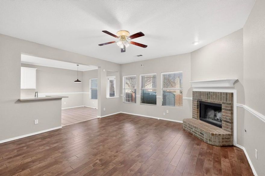 ***PRICE IMPROVEMENT*** Your Family's Next Home is Right Here. Fresh paint. New carpet. Nothing to fix, nothing to update. This Fort Worth two-story is completely turnkey and priced to sell. The layout is the real story here. The primary suite is on the main floor, the kitchen was made for gatherings, and yes, there's a dedicated theater room upstairs for movie nights and game days. This is the kind of home that fits your life from day one. Hardwood-style floors and a brick fireplace anchor the main level with warmth you can feel the moment you walk in. The kitchen features Whisper White cabinetry to the ceiling, a center island, stainless steel appliances, a breakfast nook, and a separate dining room. Every occasion covered. The primary en suite has been beautifully updated with a dual-sink white quartz vanity and sleek black fixtures. Upstairs, the additional bedrooms and theater room give everyone their own space. Every wall, trim piece, door, and baseboard professionally painted. New carpet throughout. Covered patio with ceiling fan, fully fenced backyard, and a storage shed round it out. Close to top schools, shopping, dining, and major highways. Come see it. You won't need a second visit. Texas Living at it's Finest!