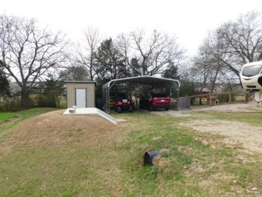 Located in a gated community. These three lots are 50 x 80 each with water, sewer and electricity available. The 5th Wheel and golf cart in photos not included, but negotiable. Improvements on these lots are storm shelter, storage building, two car carport, fenced yard and deck set in concrete. These lots are ready to move in your RV, Tiny Home or Mobile home. If you prefer to build, this is a great location, pretty treed lots, 150 feet wide and situated near the back where there is little traffic. This is a pretty treed lot, sits on a small hill and very desirable. Holiday Village offers community amenities that include a club house, swimming pool, basketball court, fishing pond, plus boat ramp and fishing pier on legendary Lake Fork. These amenities are often found in more exclusive HOA'S and POA's. Lake Fork is highly regarded as one of the bass fishing lakes in the US. Crappie and Catfish are also outstanding catches. Access directly to Lake Fork is a great asset for the fishermen and women.