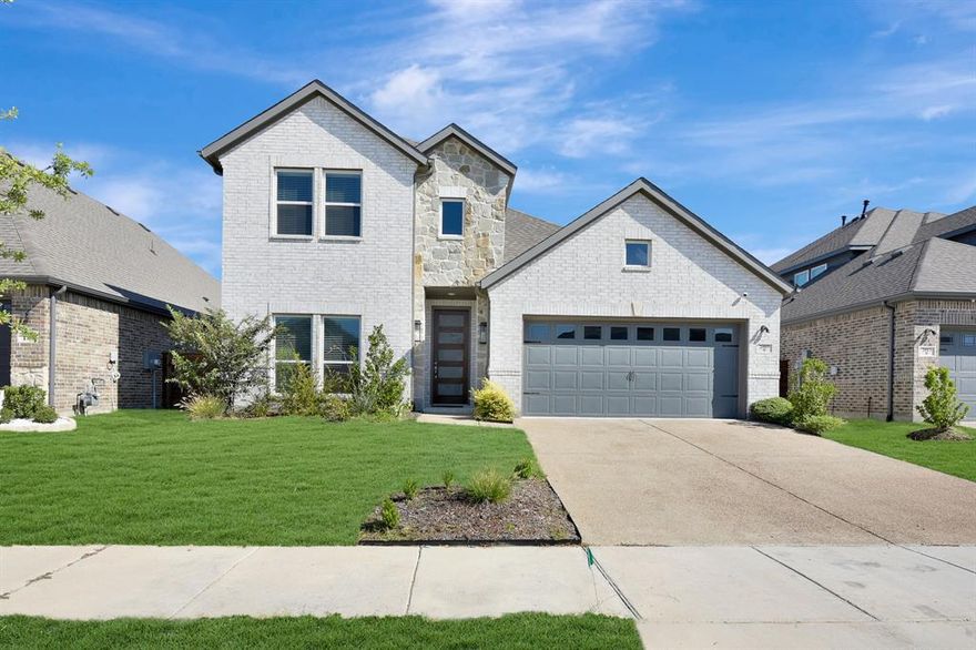 This nearly new 2023 home in the sought-after Solterra community features bright luxury vinyl flooring throughout the main living areas, complemented by crisp white cabinetry and elegant quartz countertops. The kitchen offers a gas cooktop, a window above the sink for natural light, and an open layout that flows seamlessly into the spacious living and dining areas—perfect for entertaining or everyday living. The primary suite includes dual sinks, a standalone soaking tub, a glass-enclosed shower, and a walk-in closet with ample storage. A secondary bedroom and a large utility room with a built-in hall tree are conveniently located downstairs. Upstairs, you’ll find two additional bedrooms for extra space and flexibility. Outside, enjoy a grassy yard with a covered patio and a unique tiered backyard design.