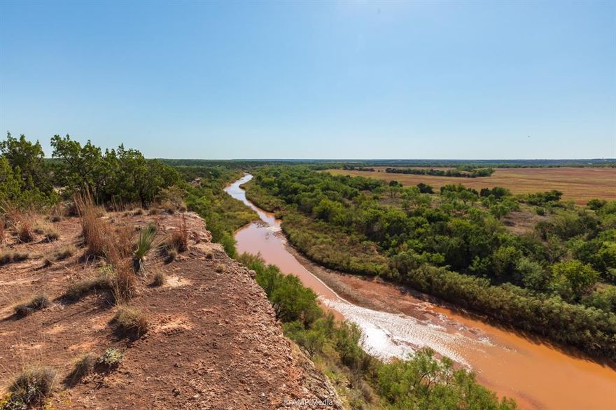 Atop the river's edge with the water flowing 100 feet below, the stillness is overtaken by the faint noise of the ripples across rocks below. The sound of the water becomes more and more noticeable as you stare out across the river valley. With a mile of river, you feel atop of the world from that view. Several spots along the river's edge give you phenomenal look at the great Double Mountain Fork of the Brazos River. A landmark for life in the area for centuries; it's easy to see why both it and the Double Mountains were used as way finders to traverse the countryside. This property gives you a multitude of experiences with the river running through it, separating the lower area from the higher rugged area. Bisected by the river, the stories of each side are very much different. The south hosts the fertile farmland framed out by a healthy belt of vegetation; quick access to the river's edge. The north hosts the elevated bluffs, panoramic views, and rocky outcrops. Both sides play host to an abundance of wildlife and both sides compliment each other as wildlife use both to habitat and roam. They say seeing is believing and that's what you experience when you step to the edge of these overlooks, you really get to see something special. Don't sleep on this river property.  Approximately 812 acres, the diversity of the property is separated by the Brazos River.  With over 20 years experience on this place hunting, the seller claims this one to be his family's favorite. Several mount worthy Whitetail bucks have been taken off the place over the years. Home to Rio Grande turkeys, feral hogs, and more. The two sides of the river will give you a variety of experiences to hunt as will the variety of the landscape. It's hard to beat a good river place come hunting season. You'll also catch some fish in the river too.