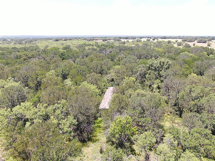 Discover the potential of this approximately 5.3-acre slice of Texas countryside, carved from a larger 11.3-acre tract. Located just outside of Early, TX, this property offers privacy and natural beauty, with a landscape heavily wooded in mature mesquite trees and a seasonal creek that gently meanders along the back boundary.
An older manufactured home sits on the property, though its condition is unknown and is being sold as-is. The property will need to be surveyed for exact boundaries. Utilities may be present, including electricity and water, and there is a septic system in place that once served the manufactured home—functionality is unknown and would need to be verified by the buyer.
Whether you're looking for a quiet rural retreat, a recreational getaway, or a potential homesite, this wooded acreage provides a great foundation with plenty of possibilities. Call today for more information or to schedule a visit.