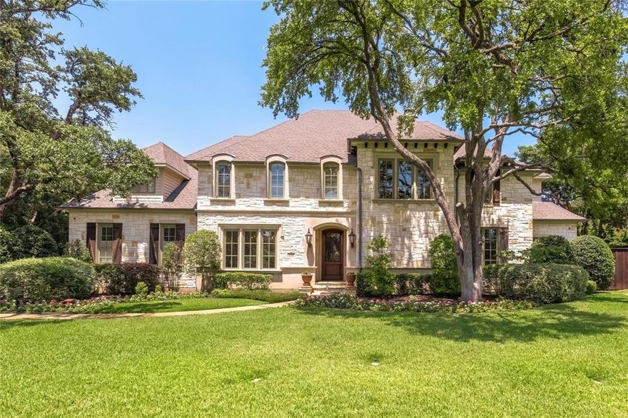 Situated on a remarkable 0.75-acre lot in the prestigious Preston Hollow neighborhood, this French-inspired custom estate is a stunning blend of timeless architecture and modern comfort. Designed for both grand entertaining and everyday living, the layout flows effortlessly throughout. Hand-scraped hardwood floors lead to the chef’s kitchen, complete with a Wolf gas cooktop and grill, double ovens, and dual custom Sub-Zero refrigerators. The open-concept design connects seamlessly to spacious living and dining areas, perfect for hosting or relaxing in style. Enjoy quiet moments in the sophisticated study, or unwind in the fully equipped media room. A private fitness room on the main floor adds everyday convenience. The luxurious primary suite upstairs featuring dual walk-in closets, separate vanity sinks, a jetted soaking tub, and a spacious walk-in shower. 3 other bedroom suite with oversized spaces, private bath and walk in closets. A large game room with a built in kitchenette and adjacent craft rooms offer flexibility for entertainment, hobbies, or additional living space. An electric iron gate secures the driveway and motor court, enhancing both privacy and peace of mind. The outdoor living area is equally impressive, with a gourmet grill, retractable screens, and a resort-style pool and spa, your personal oasis for year-round enjoyment. Welcome to a home where elegance, comfort, and location come together effortlessly—Preston Hollow living at its finest.