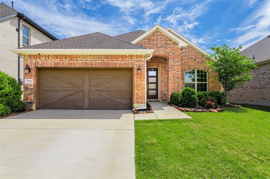 Welcome to Oak Point, Texas—just north of Dallas and minutes from Lake Lewisville—offering convenient access to the entire DFW metroplex, including both Dallas and Fort Worth.

Located in a growing lakeside community, this home features a layout designed for practical, everyday living. Upon entry, you’re greeted by a large formal dining area that can easily function as a second living space, office, or entertaining area depending on your needs.

The kitchen sits at the center of the home with granite countertops, a large island, walk-in pantry, and direct access to the main living area where a fireplace creates a comfortable gathering space. Just off the kitchen is a secondary dining area, along with additional seating at the large island, giving you flexibility for daily use or entertaining.

The primary suite is privately situated and includes dual sinks, a spacious walk-in shower, and ample storage. Two additional bedrooms provide flexibility for guests, family, or a home office.

Additional features include 6-inch exterior walls for improved energy efficiency, a tankless water heater, and a built-in pest control system accessible from the exterior.

The backyard offers both a covered patio and extended concrete seating areas, creating multiple outdoor spaces for relaxing or entertaining, along with a board-on-board fence for added privacy.