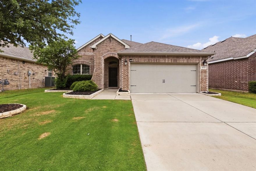 Beautifully maintained 3 bedroom 2 bath home with outstanding curb appeal and open layout. Interior features include luxury vinyl plank flooring and a neutral color palette,.  The kitchen serves as the heart of the home, showcasing  granite countertops, ample counterspace, and  cabinetry with modern hardware. Designed with both style and functionality in mind, kitchen overlooks the living and dining area, creating an inviting, open concept layout that’s perfect for everyday living and entertaining. The versatile floor plan offers a spacious flex room ideal for a home office, media room, or additional living area. The private primary suite includes a garden tub, dual sinks, and a large walk-in closet. Split secondary bedrooms provide privacy and share a full bath. Enjoy outdoor living year round with a covered back porch, perfect for relaxing or entertaining. The spacious backyard offers plenty of room for gatherings and play. Gateway Parks amenities include two pools, a splash pad, workout facility, ample amount of green spaces, walking trails, and BBQ and picnic area.