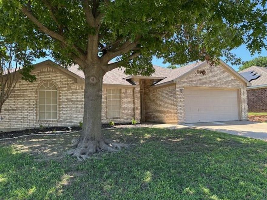 This Beautiful home is waiting for you.  It has b beautiful entry to open Living room that opens to kitchen and dining Room.  Primary Suite is spacious with entry to an inviting Bathroom with Texas sized Bathtub, Separate Shower, with a large Closet. Secondary bedrooms are good sized with Ceiling Fans and an inviting bathroom.  Kitchen offers Stainless Steel Appliances open to Dining Room and Living Room with Pretty Brick Fireplace.  Laundry Room offers additional space next to Kitchen.  Good sized Garage with Opener.  Private backyard is spacious. Solar Screens cover windows facing West to keep the Texas Summers from outdoor sunrays.  Come see this home - you will be pleased with the comfort of a neighborhood that is close to schools, Parks, Shopping and Friendly Texas Neighbors