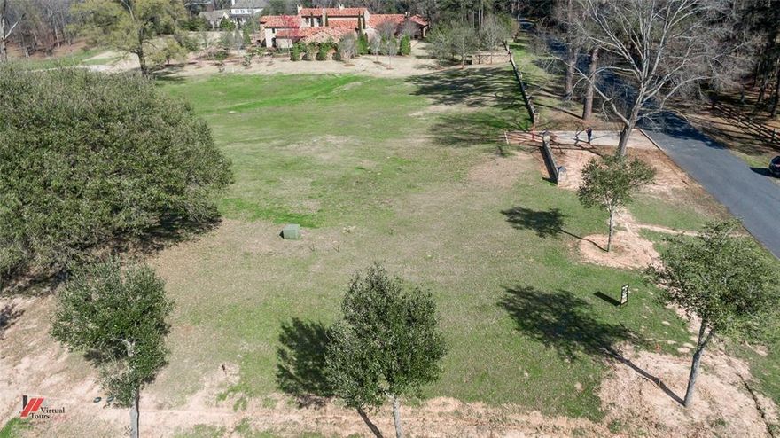 Premier location for this Esplanade lot with prominent Railsback road frontage. Approx 1.396 acres with vista like view looking North towards lake. This lot can have its own private, gated drive accessible from Railsback. This exclusive subdivision is gated at Railsback and has an entrance from Flournoy Lucas.

Please see the attached Exhibit A for the legal description.

Attached is a list of the improvements the Developer agreed to install as part of the sellers' agreement when purchased.