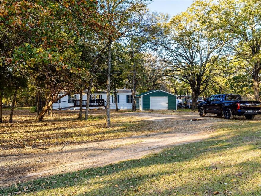 How would you like to be near the lake on over 1 acre of land? Welcome to your peaceful woodland retreat in the desirable Forgotten Acres Subdivision. This inviting home offers 3 bedrooms, 2 full bathrooms, and 1,550 sq ft of well-designed living space, freshly updated with new interior paint. Surrounded by mature trees, this property provides privacy, shade, and a forest-like setting that feels like a true country escape.

Inside, the home features high ceilings, two spacious living areas, a fireplace, and a functional layout ideal for both everyday living and entertaining. The modern kitchen is a highlight, offering granite countertops, essential appliances, generous cabinet space, and tile accents that bring warmth and charm to the space. Both bathrooms are well-sized, and all bedrooms provide comfortable living with natural light throughout. Refrigerator, Washer, and Dryer stay with the home. 

The expansive outdoor space is perfect for those who want room to spread out. The property includes a detached 2-car garage, RV parking, and additional uncovered parking to accommodate multiple vehicles, equipment, or guests. With over an acre to enjoy, the yard offers endless potential—garden areas, play areas, outdoor dining, or simply relaxing under the trees. There is ample room for gatherings, projects, or enjoying the peaceful surroundings.

Located just minutes from lake access and close to GBC shopping, the home offers the ideal balance of nature and convenience. Zoned for Mabank ISD, with private sewer, private water, and best of all—NO HOA, giving you the freedom to enjoy your land the way you choose.

Offered at $150,000, this is an incredible opportunity to own acreage near the lake with comfort, privacy, and space to grow. Agent is part owner