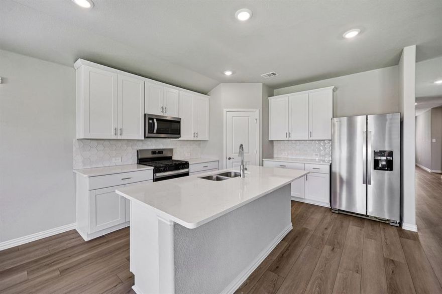 BRAND NEW energy - efficient home Mar 2026! Sip your morning coffee at the Henderson's convenient kitchen island overlooking the dining and family rooms. White cabinets with veined white quartz countertops, tan tone EVP flooring and light grey brown textured carpet.  From the $300s - Escape the bustle of the city without being too far from the action. Beat the summer heat at the private neighborhood amenity center with a pool and playground. Look forward to a future public park, adjacent to the neighborhood, equipped with pickleball courts, soccer fields, and so much more. Zoned for Anna ISD, Parks at Foster Crossing offers 12 unique floor plans to fit any lifestyle. Contact a sales counselor to learn more. Each of our homes is built with innovative, energy-efficient features designed to help you enjoy more savings, better health, real comfort and peace of mind.