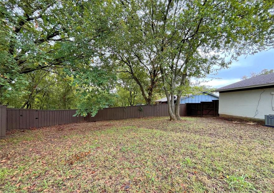 This South Sherman gem lives larger than expected, offering an open layout with 3 bedrooms, 2 baths, and a 1-car garage. Enjoy the comfort of recent updates throughout, including granite kitchen counters, refreshed bathrooms, newer HVAC, and attractive wood-look flooring.

Step through the sliding door to a rare, shaded backyard—complete with a newer privacy fence and the perfect patio space perfect for your outdoor ideas. Picture a fire pit or a cozy outdoor lounge. Even better? The rear gate opens to a peaceful stretch of trees, giving you more privacy with no home directly behind you.

The home is in move in condition and ready for you to settle right in, with just a few spots to personalize to your desires. 
*** Buyers—ASK about easy Owner Financing! ***

Moments from Hwy 1417 and US-75, and only 1.5 miles from charming downtown Sherman via 1st Street at the corner. This one is easy to love—come see it before it’s gone!