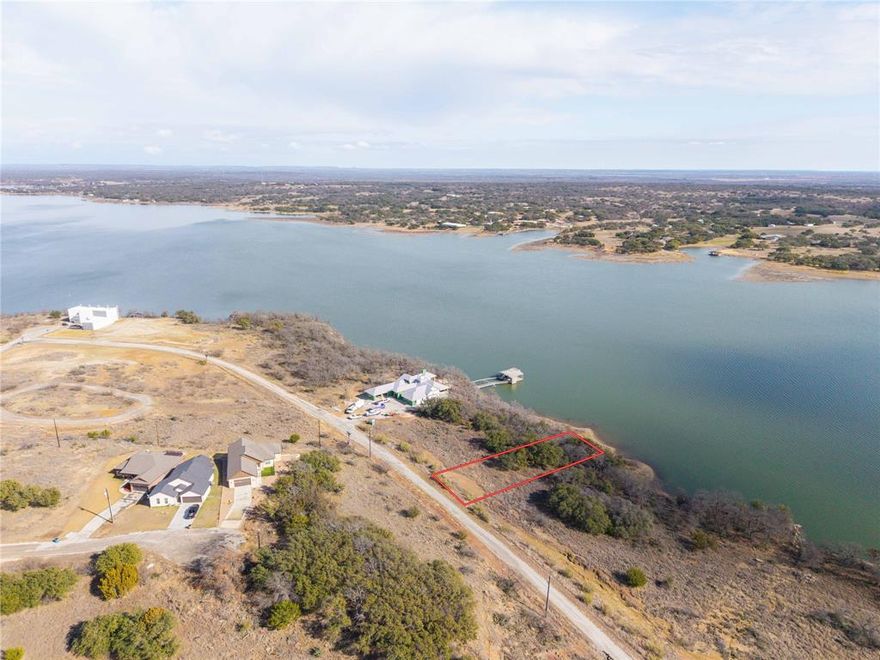 Situated on approximately half an acre of prime waterfront, this exceptional homesite offers the opportunity to create your ideal retreat on the shores of Lake Brownwood. Located within the desirable Feather Bay community, the property combines natural beauty, privacy, and access to a resort-style lifestyle that makes lake living truly special.
Imagine waking up to peaceful water views, spending your mornings fishing or kayaking from your own shoreline, and enjoying evenings watching the sun set across the lake. With ample space to design a custom lake home, outdoor entertaining areas, and room to relax, this lot invites you to fully embrace the laid-back rhythm of the lake life.
As a property owner in Feather Bay, you will also enjoy access to all the amenities of The Hideout Golf Club & Resort, including an 18-hole championship golf course, swimming pools, tennis courts, restaurant and bar, lodge, and a variety of social and recreational activities. Whether your vision is a full-time residence or a weekend getaway, this waterfront lot offers the perfect setting to slow down, unwind, and make lasting memories on Lake Brownwood.