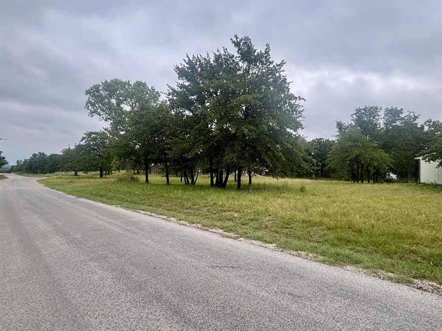 Less than one acre, this cleared lot is ready for your dream build with beautiful views of Lake Nocona. Property for sale are lots 40-43, all of Lot 1 and Part of lot 2.  The property offers a balance of open space and mature trees, creating both shade and scenery. A water well is in place, and there is also a septic system (condition unknown). Buyer or buyer agent will be responsible for verifying the condition of the septic system and water well, as well as obtaining a new survey if needed. Great opportunity to build near the lake in a desirable area!
