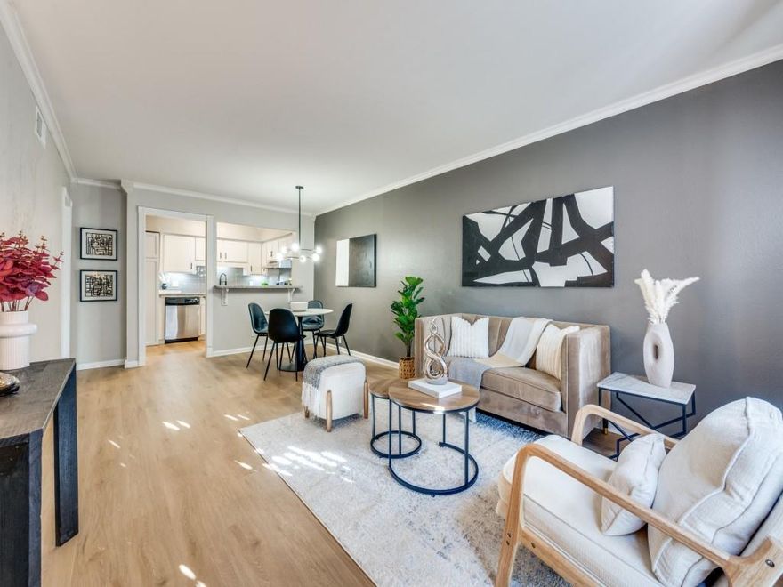 Tucked toward the back of a gated community and surrounded by mature trees, this beautifully updated 1-bedroom, 1-bath condo offers privacy, comfort, and modern style. Step inside to stunning new flooring that flows throughout the living, dining, and bedroom areas, creating a clean and cohesive feel, while updated light fixtures and a neutral color palette enhance the bright, open layout. The spacious living area connects seamlessly to the dining space, making it functional for both everyday living and entertaining, and large windows bring in natural light that adds warmth throughout. The generously sized bedroom provides a relaxing retreat with easy access to the well-maintained bathroom. Located in a limited-access community featuring a swimming pool, this condo offers low-maintenance living in a prime Dallas location near Love Field, major freeways, shopping, and dining. Washer, dryer, and refrigerator convey with the sale. Ideal for a first-time buyer or investor seeking a move-in ready property in a strong rental corridor.
