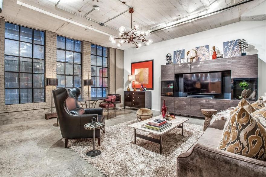 STEP INTO SOPHISTICATION with this cozy loft in the heart of Downtown Dallas. Full of character, this condo is located in the historic SoCo Urban Lofts building featuring high ceilings and an open living space. Just outside your door, the city awaits: with the AT&T World Headquarters, Dart Train Station, top restaurants, and lively nightlife all within walking distance. Come home to resort-style amenities including a rooftop pool with sweeping Dallas skyline views, outdoor spaces with community grills, and a modern fitness center with a yoga room & a boxing room, a laundry room and plenty of community events. Enjoy round-the-clock security, 2 secure assigned parking spaces, and your own climate-controlled storage unit for complete peace of mind. Your lifestyle is made easier with high-speed internet, trash & water included in the HOA.

Love the furniture? This carefully curated set up composed of designer furniture, tasteful decor, fully equipped kitchen, TV and sound system can all be part of the purchase agreement to make this the perfect move-in ready space; please inquire with listing agent for the itemized price list. 

Whether you want an urban retreat, a stylish second home, or a ready-to-go investment, this property offers unmatched convenience and style in one of Dallas’s most desirable locations.