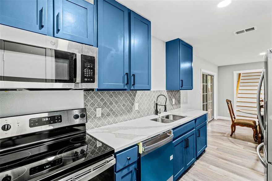 Beautifully renovated two story 3 bed 2 bath home with a double door 2-car garage. First floor features a spacious living area with stunning wood vaulted ceilings and a mesmerizing modern linear electric fireplace with color changing display. The galley kitchen boasts quartz countertops, all new shaker cabinets, stainless appliances, beautiful tile backsplash and plenty of counter space and storage. Large sliding glass door leads from the dining area to the covered patio and let in plenty of natural light. Down stairs you will also find the extremely spacious master bedroom with a walk in closet, a secondary bedroom with a walk in closet and a large modern full bathroom. Upstairs features a second full bathroom with tons of storage and beautiful walk in shower, an over sized walk in hall closet and a huge bedroom with a walk in closet, a skylight and beautiful floor to ceiling built ins. The second floor is perfect for a master floor or home office. Large shed and fully fenced yard.