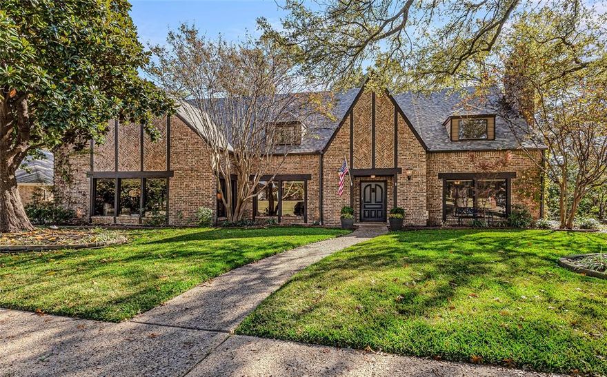 Welcome to this stunning custom-built English Tudor tucked in the heart of McKinney, Texas—nestled in a well-established neighborhood with no HOA and surrounded by timeless charm. From its classic ivy-covered exterior to its warm, inviting interior finishes, this home blends old-world craftsmanship with modern comfort. Step inside and be greeted by an impressive staircase, custom wood paneling, intricate molding, and high-end lighting that set the tone for the entire home. The library, complete with rich built-in shelving, offers the perfect space for work or quiet retreat. The chef’s kitchen features handcrafted hardware, gas cooktop, custom cabinetry, and a spacious utility room with elevated design elements. The great room stands as the heart of the home—showcasing beautifully stained paneling, exposed wood beams, a cozy lodge-style fireplace, additional staircase and a charming wet bar ideal for entertaining. The primary suite is a thoughtfully designed retreat, offering his and her closets and dressing areas complete with vanity, jacuzzi tub and walk in shower.  Upstairs, you’ll find an office, a flex room, and three generous bedrooms. One of these bedrooms functions as a second primary suite, complete with its own en-suite bathroom—perfect for guests or multigenerational living. Outdoor living is where this property truly shines. Multiple French doors, with built in screens, open to an expansive backyard oasis featuring a pool and spa, extended covered patio, and a deck overlooking the creek. Mature shade trees provide privacy and ambiance, while a custom-built chicken house adds a unique touch of country charm. Home features Generac system ensuring uninterrupted comfort. This rare gem offers character, space, and lifestyle—located close to historic downtown McKinney, shopping, dining, and top schools, all in a neighborhood known for its care and charm. A beautiful blend of English elegance and Texas comfort—this is a home you simply must experience.