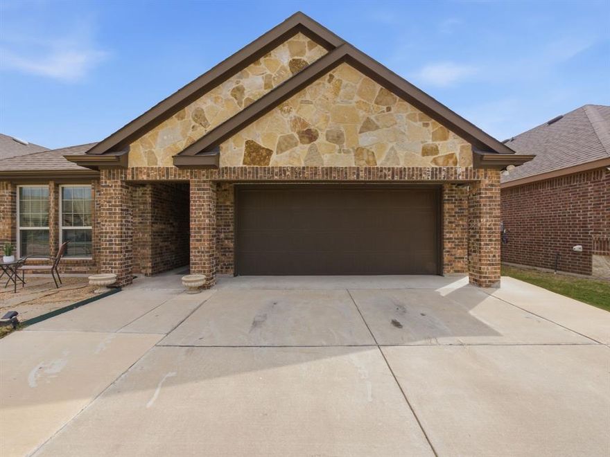 Beautiful, warm & cozy from the start! This home greets you with a flagstone patio and as you walk through the gorgeous ornate wood, iron and glass front door you enter into the entry with a custom accent wall to arched doorways and into an open floor-plan. This welcoming home has 3 bedrooms and 2 full bathrooms with a large family room that flows into the eat-in kitchen with granite counter tops, walk-in pantry, SS appliances, induction range, and an added kitchen island with a marble top which will stay with the home. Beautiful luxury laminated flooring in the main areas, tall ceilings and ceiling fans in all rooms. The primary bedroom is spacious with a walk-in closet of your dreams that has a custom Container Store system. The utility room fits a full size washer & dryer and has shelving to store all needed essentials. The washer & dryer and the smart google nest doorbell will stay with the home. The backyard has a covered patio with a large extended concrete patio that will fit all your outdoor living and cooking furniture. This home is not in an HOA and close to major highways, Waxahachie Sports Complex, restaurants and more. There is still 3 years left on the Builder 10year warranty with RWC, warranty brochure available.