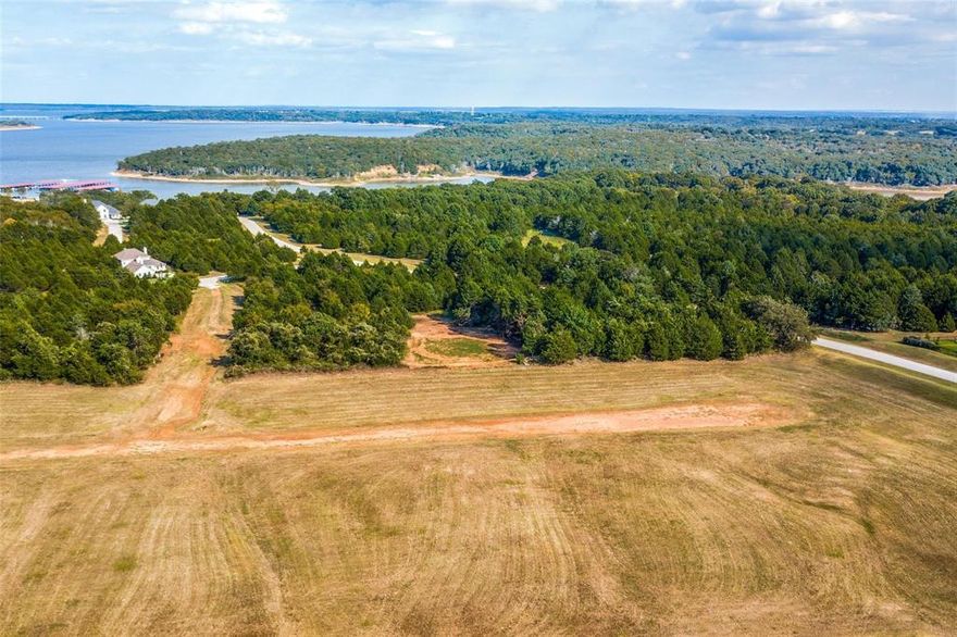 Resort style living just minutes away from Lake Texoma! This lot is located within the Rock Creek community in Gordonville, TX. The community features golfing, fishing, boating, tennis, spa, fitness center and so much more! Perfect opportunity to build your dream home in this resort styled community. Don't miss out on this fantastic opportunity!