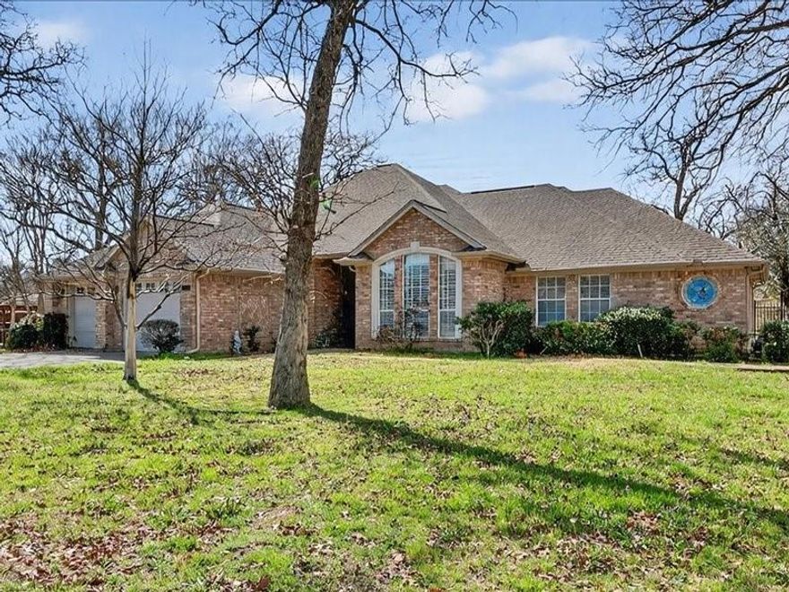 Located in highly sought-after 76013, this custom home—built by the seller’s family in 1994—reflects thoughtful design, quality craftsmanship, and comfort-focused living throughout.
Constructed with extra insulation and 2x6 exterior walls for year-round efficiency and recently upgraded with insulated garage doors for the oversized, 19’x26’-2 car garage including built-in cabinets, the home features solid pine wood flooring, enhancing both warmth, quality and durability. Custom ash built-in cabinetry adds timeless character in the living spaces and kitchen, complemented by custom crown molding and plantation shutters across the front of the home.
The kitchen is designed for both everyday living and entertaining, offering bay window kitchen seating, a center island boasting a newer electric cooktop, and double ovens. The walk-in pantry and extra storage throughout the home allows for organized living. A separate built in desk adds to the function of this unique home. In addition, a cozy gas fireplace anchors the main living area adorned with custom windows.
Accessibility was thoughtfully considered, with an ADA-compliant primary suite and main living areas, including a 2020 renovated walk-in shower in the primary bath. The well designed walk-in closet includes plenty of space as well as built in storage for shoes.
Additional highlights include a tankless water heater and a relaxing screened-in porch—perfect for enjoying Texas evenings in comfort.
Experience a rare opportunity to own a well-built, custom home in an established and desirable location.