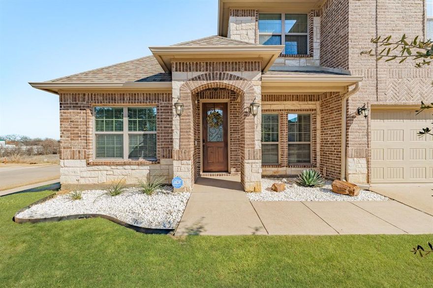 Welcome to this beautifully designed home in sought-after Burleson ISD, where thoughtful architecture meets everyday comfort. Perfectly positioned on a peaceful corner lot, this residence offers the ideal balance of privacy and convenience - tucked away in a quiet neighborhood yet just minutes from shopping, dining, and an easy commute into DFW. Step inside to an open floor plan enhanced by soaring vaulted ceilings and charming architectural arches that give the home a custom, timeless feel. At the heart of the main living area, a stunning stone fireplace with mantle creates a warm, inviting focal point - perfect for gathering with family and friends. Natural light flows effortlessly throughout the space, highlighting the seamless connection between the living room, dining area, and kitchen. The bright, timeless kitchen features crisp white cabinetry, white quartz countertops and island, making it both stylish and functional - a space where everyone naturally comes together. Whether you’re hosting or enjoying a quiet night in, the layout is designed to fit your lifestyle. With 4 spacious bedrooms and 2.5 baths, this home offers flexibility for growing families or guests. A private office with French doors provides an ideal work-from-home setup, while an extra living room and upstairs loft space offer endless possibilities - second living area, game room, guest retreat, or relaxing escape. The balcony overlook adds a sense of openness and architectural elegance, connecting the spaces beautifully. Outside, enjoy the serenity of the corner lot with an open feel and nearby neighborhood park, perfect for walks and outdoor fun. A brand-new roof was installed in March 2026, offering added peace of mind for the next owners. This home truly has it all - space, style, location, and character - ready to welcome you home.