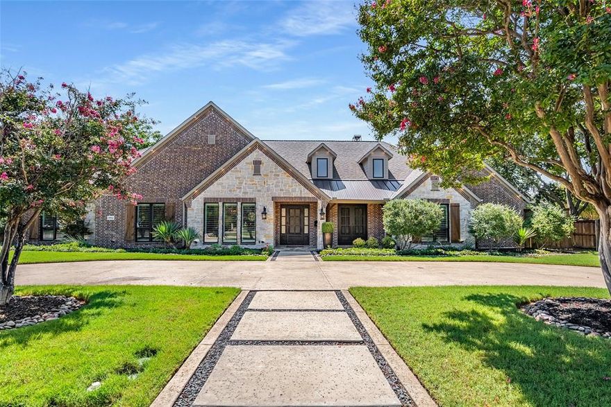 Nestled in one of Dallas’ most beloved neighborhoods, this beautifully updated home in the Disney Streets offers sophisticated qualities and endless amenities. From curb appeal to a show-stopping backyard, you’ll get just about everything a home can offer.  As you enter you are greeted with hand scraped hardwood floors through the main house and an airy feel with cool toned walls as the space opens to a sprawling living room flowing seamlessly to the dining room into the crown jewel - the gourmet kitchen. Here you will enjoy ample custom cabinetry, a 12 foot kitchen island, premium appliances including a 48” 6 burner gas stove, double ovens, Sub Zero refrigerator and freezer, built-in craft ice machine, dry bar with a beverage cooler, custom lighting, and more. The living room is anchored by a striking floor to ceiling stone fireplace for a cozy evening or entertainment with spacious seating - all whilst looking out to crown jewel number two - the outdoor living space. Beautifully designed with stone flooring and a show stopping outdoor kitchen equipped with a built-in grill, Egg smoker, flat top grill, warming drawers, oversized island, beverage cooler space, and seating area all encased with retractable screens. When open, enjoy the views of the outdoor fire pit and lush backyard! The primary suite offers a spacious bedroom with seating, patio access, and complete with an en-suite bath designed with separate vanities, standing shower, freestanding soaking tub, and a large custom walk-in closet with amenities including a built in jewelry cabinet, built in safe, custom lighting, and more. The upstairs provides a secondary living space flooded with natural light spanning nearly 1,000 sqft complete with a full bath, wet bar, storage, and more. Whether used as a game room, media space, or guest retreat, it’s a versatile bonus to an already well-designed home. Every corner turned, this home offers thoughtful designs and comfortability for any style of living!