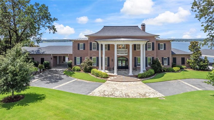 The Overlook at Eagles Bluff, Lakefront Luxury with Unrivaled Views of Lake Palestine!

Discover a rare jewel in East Texas—The Overlook at Eagles Bluff, a 3.44-acre lakefront estate nestled in the prestigious Eagles Bluff Golf Course Community. Inspired by the charm of the Goldman-LeGrand House Museum and offering panoramic views of Lake Palestine, this custom-crafted home blends refined elegance, modern comfort, and natural beauty.

From the moment you arrive, you’re welcomed by stately architecture, soaring ceilings, and intricate crown moulding. A handcrafted Swarovski crystal chandelier adds timeless glamour, while the wine cellar and richly appointed main office with custom woodwork elevate the home’s luxurious appeal. The layout features a butler’s pantry and elevator for effortless entertaining and daily convenience.

Wake to lake views from the first-floor primary suite, where expansive windows frame the infinity pool and shimmering water beyond. Two guest bedrooms and a game room also offer stunning lake vistas.

Step outside to your private resort with a fully equipped outdoor kitchen and pavilion, and colonnade details adorning both front and back porches. A professionally engineered seawall protects your shoreline, while an irrigation system using lake water keeps the lush landscaping and blooming trees thriving. A boathouse provides lake access, and the porte-cochère and 4-car garage with Carriage-style doors accommodate all your vehicles and lake toys. You will also find other fantastic additions to this exceptional property that incude a great security system, landscape lighting, abundance of outdoor speakers, a natural gas generator, and built in compressor.

Whether you're teeing off or watching the sunset, life at The Overlook at Eagles Bluff offers the perfect blend of relaxation, recreation, and prestige. Homes of this caliber rarely come to market—don’t miss your opportunity to own a piece of lakefront paradise.