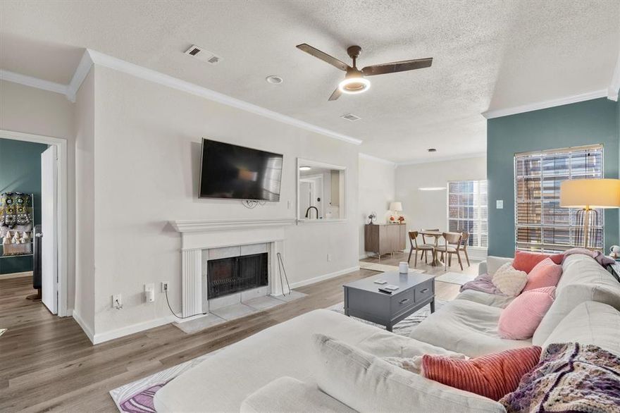 Welcome home to this beautifully updated first floor condo that combines style, comfort, and convenience! The open concept layout creates a seamless flow between the kitchen, dining, and living area, highlighted by gorgeous hardwood flooring throughout and fresh updates including new lighting, updated ceiling fans, and a cozy gas burning fireplace. The kitchen has been recently refreshed with sleek new countertops, a new backsplash, updated fixtures, and fresh paint, making it as functional as it is attractive. Step outside onto your private patio, where tranquil views of the community pond create the perfect spot to enjoy your morning coffee or evening wine. The spacious primary suite room offers a large walk-in closet and the primary bathroom features dual sinks along with a separate shower and soaking tub. The secondary bedroom also has walk-in closet, great natural light and has direct access to the second bathroom. A covered parking space is located directly in front of the unit, with plenty of additional guest parking available throughout the community. Residents enjoy low maintenance living with a community pool, club house and HOA dues that include cable and water. With its prime location just minutes from shopping, dining, and major highways, this home makes it easy to experience all the best of North Dallas living. Move right in and enjoy a lifestyle that blends comfort and convenience. THIS HOME QUALIFIES FOR ZERO DOWN, RATES AS LOW AS 5.77% and UP TO $6,500 in lender credits with preferred lender.