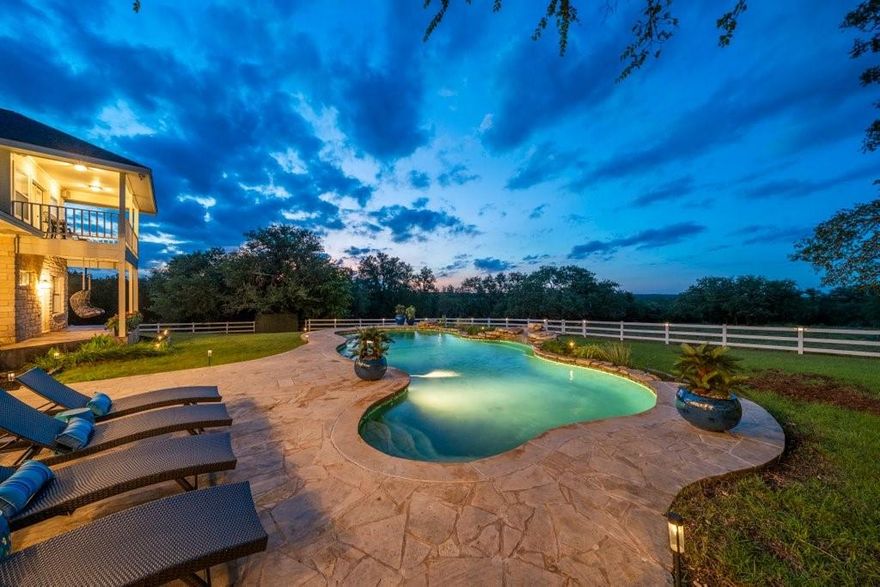 Hill Country luxury awaits in this two-story estate on 25 acres in the heart of San Marcos. Features game room, office, pool, horse barn & more! This 3,975 sqft home was completely remodeled in 2023. You’ll find quartz & granite countertops & all new fixtures, ceiling fans, flooring & carpet. A chef’s kitchen with double oven & induction stovetop opens up to a dining area & living room. The primary suite & a mother-in-law suite are downstairs along with a game room, office, mud & laundry room. Head upstairs for another large bedroom suite, two additional bedrooms with a Jack & Jill bath & a 4th bedroom with balcony. Pool with Waterfall Feature, Courtyard Fountain, ˜2,000 sqft Horse Barn, Outdoor Kitchen, Fire Pit, Swings, Fully-Fenced, Automatic Gate, Ample Parking in Addition to 3 Car Garage. Ag Exempt - LOW TAXES, No Deed Restrictions or HOA, removed from ETJ. Owner-Agent will consider conveying all furnishings. Can be sold with adjacent 20 acres & home. Buyer to confirm all info.