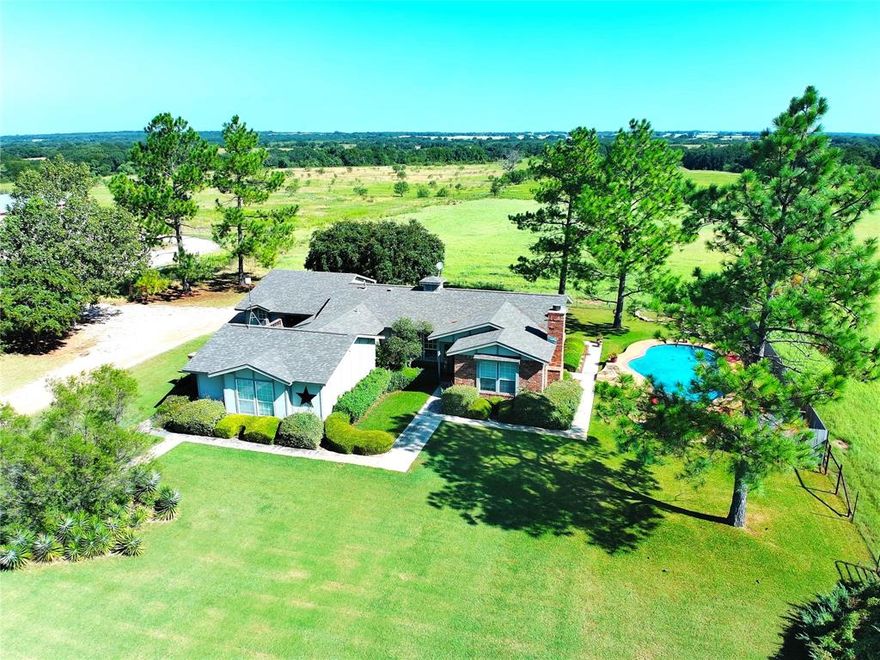 Welcome to your dream place! Close to town with a SHOP & POOL!! This 3 bedroom, 2 bath custom brick-stucco home sits on approximately 12.4 Acres. Livingroom is very welcoming & cozy with a stone fireplace...gas logs, but can also be wood burning. The open patio has a firepit & outdoor shower! 2 car carport, covered porches, landscaped & plush grass! Water well & Comanche County water & Co-op electric. Property is currently Ag Exempt! The in-ground pool has a beach entrance! About 6 acres of coastal is fenced, 5,000 sq ft SHOP sits on over 5 acres! You've got to come see all this place has to offer! Buyer and buyers agent to verify all info.