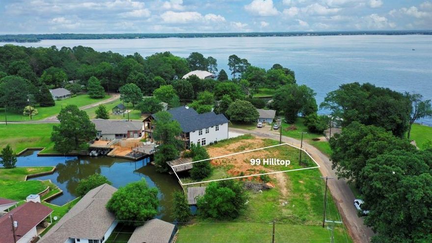 Lot 37 provides a generous 0.142 acres of waterfront channel land with concrete retaining walls already in place, a shared boathouse with party deck, water & sewer at the street, and surveys available. There is ample space along the water’s edge to create your ideal outdoor living area, whether adding a firepit, hot tub, or relaxing seating area. Seller has plans for a 4BR, 3BA, 2-car approx. 2,100 sq ft home. Deed restrictions require a minimum 1,100 sq ft HVAC living area, and the area benefits from having no active HOA. Plenty of usable shoreline for relaxing lake days. Just over an hour from Dallas and near Triple N Ranch Winery, The Whistlestop, Tiki Hut, Lone Star Marina, as well as Fig’s Steakhouse and Fig’s Backyard. Great investment potential! Seller will consider package pricing for buyers wishing to purchase multiple lots.
