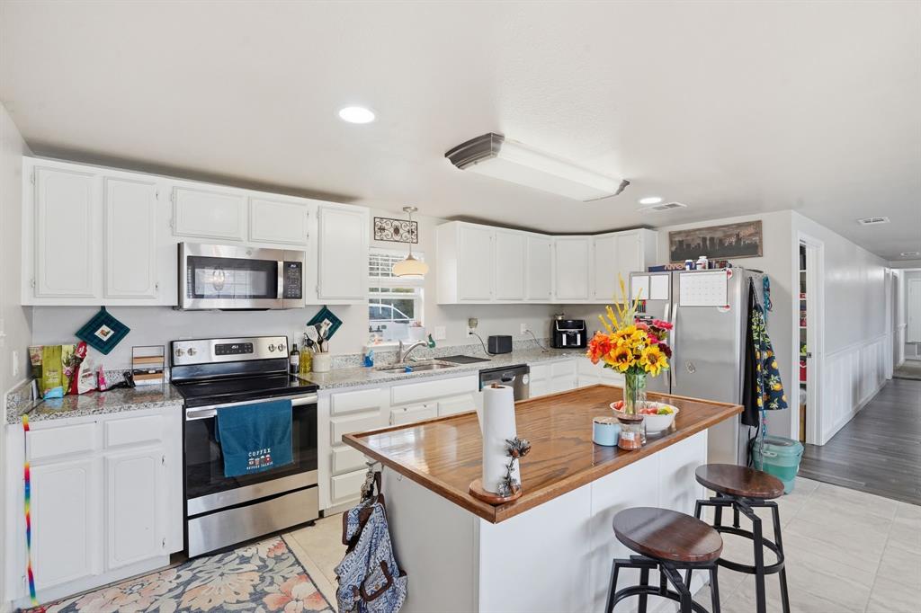 7701 John T White Road