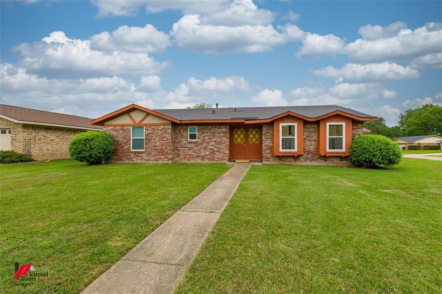 Located in Central Plaza Subdivision in Bossier City, 518 Yale Place offers a spacious layout, character-filled details, and approximately a quarter-acre lot with room to enjoy both inside & out.

This single-story home features 3 bedrooms, 2 full baths, and multiple living & dining spaces designed for flexibility. The main living area features vaulted ceilings with exposed beams, wood paneling, and a brick fireplace with a gas starter, creating a warm, inviting focal point. A second living or sitting area provides additional space for everyday living, hobbies, or entertaining.

The kitchen includes ample cabinet storage, pantry space, a breakfast area with natural light, and a nearby utility room for convenience. A formal dining room offers a dedicated space for gatherings or can easily function as a home office or flex space.

The primary suite includes an ensuite bath, while two additional bedrooms share a hall bath. Throughout the home, you’ll find a mix of updated flooring and original features, offering a blend of comfort and opportunity for personalization.

Situated on approximately a quarter acre, the property includes a fenced backyard, open patio area, and storage building, providing space for outdoor living, pets, or gardening. The attached 2-car garage and side entry driveway add convenience and functionality.

Conveniently located near Benton Rd, I-220, Barksdale Air Force Base, shopping, dining, and everyday amenities.

This property offers solid space, character, and the potential to update it to make it your own.