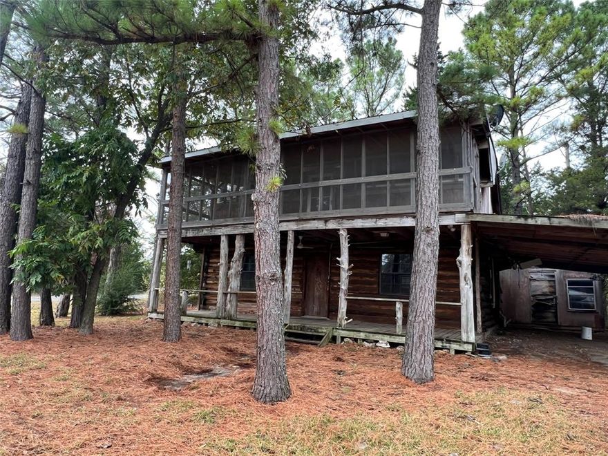 Price Reduction Just in in for Start of Summer!!  LAKE TEXOMA closeby...Escape to the serenity of lake life with this charming 2-bedroom, 1-bath log cabin nestled in the sought-after Simmons Shores community. Perfectly positioned just minutes from the lake and a short drive to Highport Marina, this cabin is ideal as a weekend getaway, a cozy full-time home, or a fantastic potential short-term rental opportunity. Set on a lush, tree-filled lot, the home exudes rustic charm with its warm wood interiors, wood-burning stove, and tranquil ambiance. Outside, enjoy a range of community amenities including a pool, boat ramp, and a fishing pier—everything you need to unwind and enjoy the water.  Whether you're seeking a peaceful retreat or a profitable investment property, this Simmons Shores cabin offers the best of both worlds!  This home has potential for someone with vision. Cash offers only.