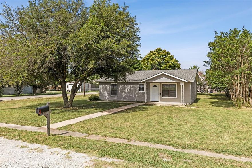 Gorgeous remodeled home on a large treed corner lot in the downtown Anna neighborhood! Open kitchen with new cabinets, granite countertops, gas cooktop, and refrigerator. Designer paint throughout the home along with updated ceiling fans, fixtures, and luxury vinyl plank flooring. Two large bedrooms with a large remodeled bathroom with granite, separate shower, and garden tub.  Separate utility room.  Many cabinets in the kitchen, bath, and laundry room for fabulous storage. Convenient storage shed in backyard. Gorgeous live oak out front. Pets on a case-by-case basis. Walking distance to post office and downtown Anna restaurants. Easy access to hwy 75.