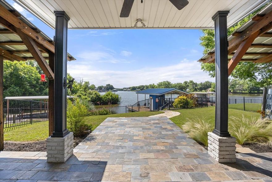 Location, location...location! This rare find boasts everything desireable in a waterfront home on Lake Granbury--walk-out water on large quite lagoon...that's also an easy walk to the historic Granbury Square. This charming 3 bedroom 2 bath home is situated on a tranquil cove of Lake Granbury with easy access to main lake and only .3 miles to the Square. This home is perfect for entertaining guests or simply enjoying lake life and a great location to enjoy everything the Granbury Square has to offer...dining, shopping, entertainment as well as the parades and fireworks! This single story home features a primary bedroom with a well-appointed en-suite and walk-in closet. The kitchen, dining room and living room have an open concept with stunning views of the lake. Kitchen has stainless steel appliances and includes a double oven and gas cooktop. Home is south facing so you will enjoy beautiful sun-rises and cool evenings with the sun setting behind you while enjoying all the wildlife that surrounds you. New LED recessed lighting recently installed. New carpet in all bedrooms in October 2024. New interior paint throughout in November 2024. Seawall was rebuilt in December 2024. New high-end aluminum dock and boat lift with storage closet was installed in December 2024 and features long lasting, easy to maintain Trex decking.  New Class 4 roof and gutters were installed in July 2025. Shared storm shelter in cul-de-sac and community irrigation (from the lake). Don't miss the opportunity to make this exceptional property your new home, a second vacation home...or continue its use  as an established short term rental investment (already approved by the city of Granbury).