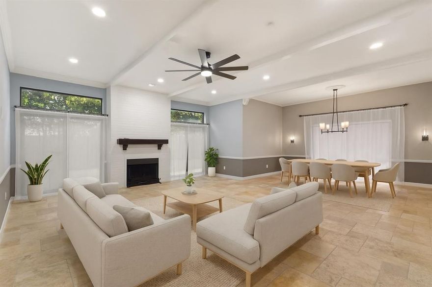 Welcome to this beautifully updated gated townhome-style condo on the edge of Addison, offering convenient access to nearby shopping, dining, and entertainment. The open-concept layout features a remodeled kitchen with granite counters, cabinet lighting, stylish finishes, and travertine flooring throughout the first floor. The living and dining areas receive excellent natural light through sliding glass doors and include updated lighting fixtures. Additional updates include new hardware throughout the home. Enjoy two fireplaces—one in the living room and another in the primary bedroom. The spacious primary suite features a cathedral ceiling, fireplace, jetted tub, and a versatile loft accented by a stained-glass ceiling light. The second bedroom includes a private bathroom, a sitting area, and a large walk-in closet. The third bedroom has access to a full bathroom and offers flexible use for various needs, including a home office. Step outside to a private, newly added back patio with attractive landscaping. Community amenities include a large pool and clubhouse. Additional highlights include Lo-E windows, extra garage storage, and mature trees that contribute to a serene setting. The HOA maintains the foundation and foundation plumbing, community and front-yard landscaping, pest control, water, trash, and the community pool and clubhouse.