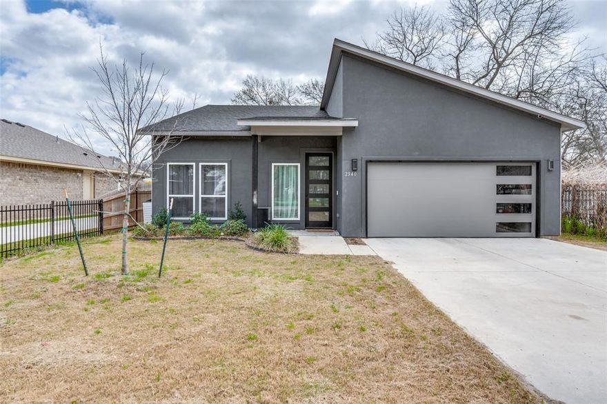 Step into the home of your dreams! This stylish residence features four generous bedrooms and two upscale bathrooms, perfectly tailored for modern living. At the core of this home is a culinary enthusiast's kitchen, showcasing a stunning island with beautiful quartz countertops and custom cabinetry, perfect for both meal preparation and entertaining guests. Experience warm, cozy nights in the welcoming living space, accentuated by a sleek electric fireplace. The primary bedroom serves as a true sanctuary, complete with a spacious walk-in closet. Every room is skillfully crafted to harness natural light, creating a bright and airy ambiance throughout. With a harmonious mix of contemporary design, practical layout, and meticulous craftsmanship, this recently built home is poised to provide an exceptional living experience. Seize the opportunity to make this modern masterpiece your own!