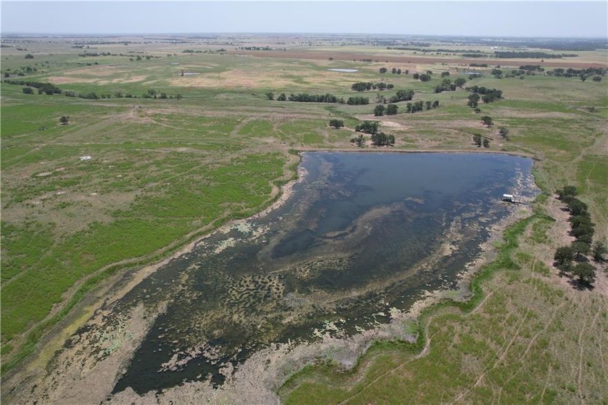 The property for sale is a substantial 408-acre tract located on FM 1444 near Ben Arnold in Milam County. Key features include:

    Size and Location: The expansive 408 acres offer plenty of space for various uses, situated conveniently on FM 1444 near the community of Ben Arnold in Milam County.

    Water Features: The property boasts four ponds and an approximately 6-acre lake, providing ample water resources for livestock, irrigation, or recreational activities like fishing and boating.

    Fencing: The land is well-fenced, making it suitable for agricultural activities, particularly livestock grazing.

    Grass: The pastureland is covered with a mix of coastal, common, and Bermuda grass, ideal for grazing and hay production.

This property is well-suited for agricultural endeavors, recreational activities, or even as a potential site for development, offering a blend of natural beauty and practical amenities.