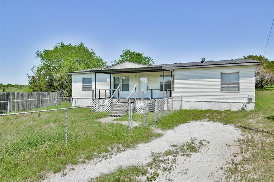 Nestled in the charming Sky Harbour subdivision near Lake Granbury, this newly renovated mobile home offers spacious living with modern comforts. Situated on over a quarter of an acre, this property features four bedrooms and two bathrooms, providing ample space for families and guests. 
Home Features
• New Carpet: Luxurious new carpeting throughout the home.
• New Roof: A brand new roof ensuring durability and peace of mind.
• New Aerobic Septic System: new septic system installed.
• All New Pipes: Complete plumbing overhaul with brand new pipes.
• Newly Painted: Freshly painted interiors in modern, neutral tones.
• New HVAC: Updated HVAC system for efficient heating and cooling.
The spacious dining area and extra living room features a cozy wood-burning fireplace, perfect for chilly evenings. The new carpet adds warmth underfoot, and a decorative ceiling fan enhances the room's ambiance.The dining area is designed for comfort and functionality, with ample space for a dining table and cabinets. It's the ideal spot for family meals and entertaining guests.Boasting new vinyl plank flooring, the roomy kitchen is both stylish and practical. It's equipped with plenty of counter space and storage, making meal preparation a breeze. The primary bedroom is a retreat of its own, featuring all-new carpeting and an en-suite bath. This spacious room offers a tranquil space to relax and unwind. Each of the three guest bedrooms is fitted with new carpeting, ensuring comfort and style. These rooms provide versatile space for family, friends, or a home office.Don't miss the chance to explore this great property in Granbury, TX. Granbury is a thriving town with excellent shopping and dining options. Enjoy the scenic beauty of Lake Granbury and the historic charm of the Square in downtown Granbury.
This beautifully renovated mobile home is ready for you to move in and start enjoying all that Granbury has to offer. Make it your new home today!