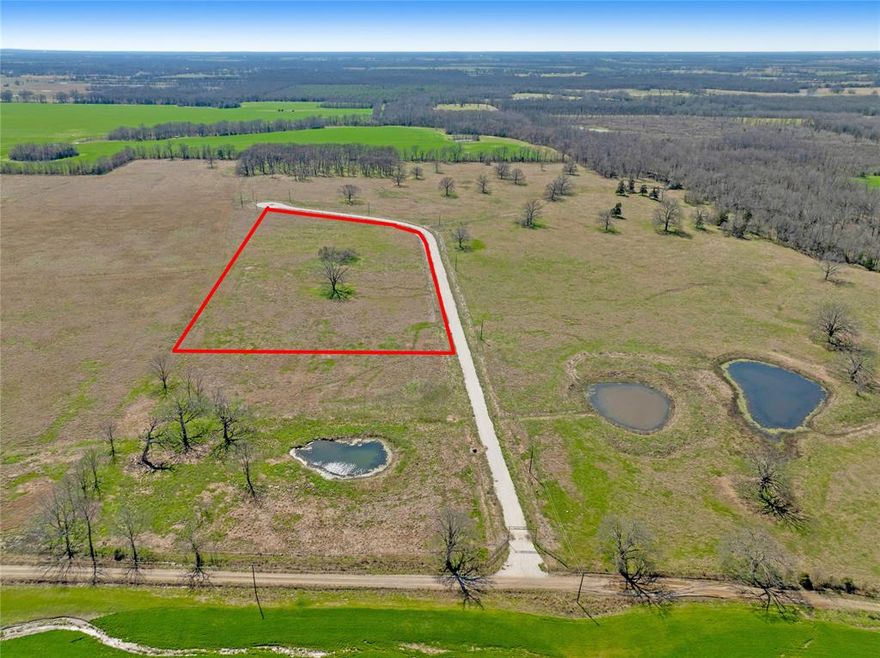 10.01 acres of blank canvas.  Ranches at Quail Hollow is a new subdivision located in the southern part of Lamar County approximately 13 minutes to Loop 286 in beautiful Paris, TX and less than 1.5 hours from the DFW Metroplex.  The Ranches at Quail Hollow is located in a peaceful natural setting surrounded by nature.  The subject property has lots of road frontage with several options for new construction placement.  The shape, layout and road frontage make this lot one of the most desirable in the development. The land can be used for residential, recreation, and or agriculture purposes.  There are limited restrictions to maintain harmony and property values.  Perfect for a mini-ranch or hobby farm.  Plenty of space for the kids to play and livestock to roam.  There is a huge 100+ year old Pecan tree plus a very cool & interesting Bois Arc tree near the middle of the property.  Another plus is it is located in the desirable Prairieland I.S.D and outside the city limits so there are no City Taxes!  Bring a set plans and start building your future on this Texas gem!