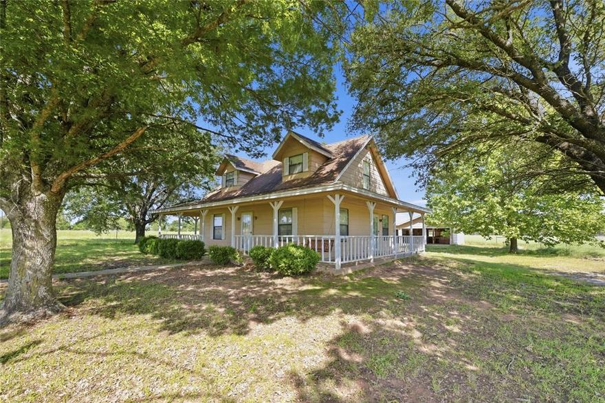 Opportunities like this are getting harder to find! 14.46 usable acres, mature trees, and a country home ready for your personal touch. This 3-bedroom, 2-bath property offers the space and privacy buyers are searching for.

With 2,240 square feet, the layout is functional and comfortable, featuring the primary bedroom and detached bath on the main level, along with a spacious living area, dining space, kitchen, and utility closet. Upstairs, two additional bedrooms and a full bath provide room for family or guests.

The home has been well maintained and offers a great foundation for updates over time, allowing you to tailor the space to your own style while enjoying the acreage from day one.

A three-sided wraparound porch provides the perfect place to unwind and take in the views. Currently used for hay production, the level acreage is versatile, ideal for horses, cattle, hobby farming, recreation, or simply enjoying the freedom of country living.

If you’ve been looking for usable land with privacy and long-term potential, this property offers a rare opportunity to make it your own.