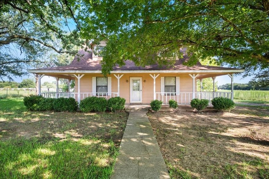 Opportunities like this are getting harder to find! 14.46 usable acres, mature trees, and a country home ready for your personal touch. This 3-bedroom, 2-bath property offers the space and privacy buyers are searching for.

With 2,240 square feet, the layout is functional and comfortable, featuring the primary bedroom and detached bath on the main level, along with a spacious living area, dining space, kitchen, and utility closet. Upstairs, two additional bedrooms and a full bath provide room for family or guests.

The home has been well maintained and offers a great foundation for updates over time, allowing you to tailor the space to your own style while enjoying the acreage from day one.

A three-sided wraparound porch provides the perfect place to unwind and take in the views. Currently used for hay production, the level acreage is versatile, ideal for horses, cattle, hobby farming, recreation, or simply enjoying the freedom of country living.

If you’ve been looking for usable land with privacy and long-term potential, this property offers a rare opportunity to make it your own.