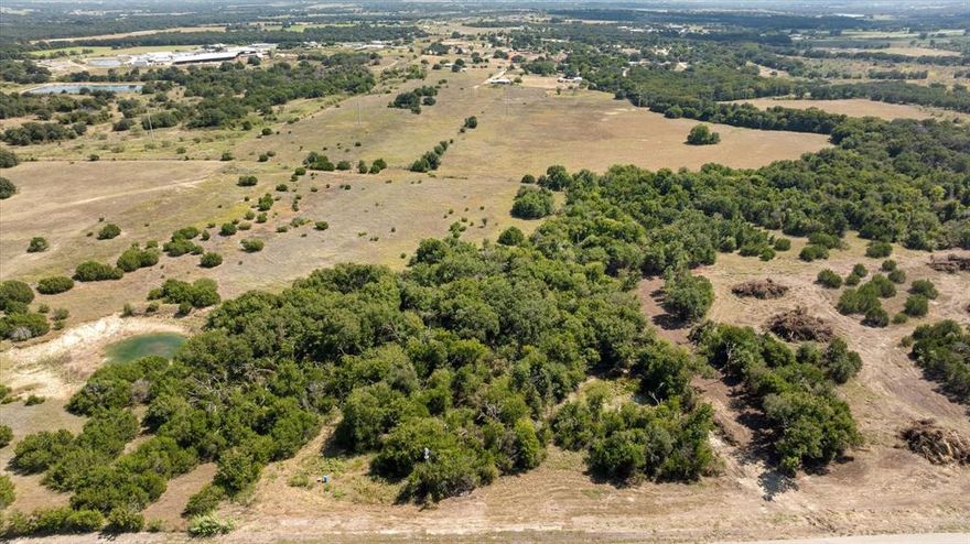 LOT 1 is 2.753 acres & could be increased in size at the back end of the property. This Lot 1 has a brand new just installed Well. Power is being brought along County Road for future access as an included feature. All Lots are 2-3 acres Tracts. Great Location on Paved Road outside City Limits. This is a great opportunity to Build your perfect Dream Home in a great area just outside of town. Additional Lot MLS 21060332, 21060626, 21060753, 21060726, 21060730, 2106043, 21060446,21060764, 21060786 Buyer will be required to get a new Survey