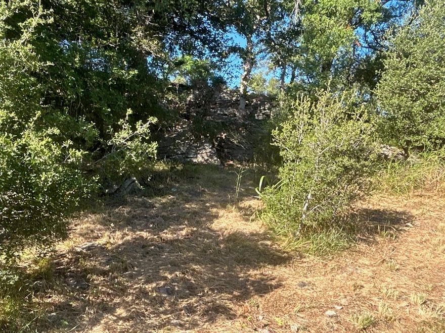 Beautiful over Two Acre home site on the Mountain overlooking the Brownwood Country Club. Property boasts beautiful trees rock formations and unbelievable views of the valley below. One of the very last places to build in this area and you can build the home of your dreams.
