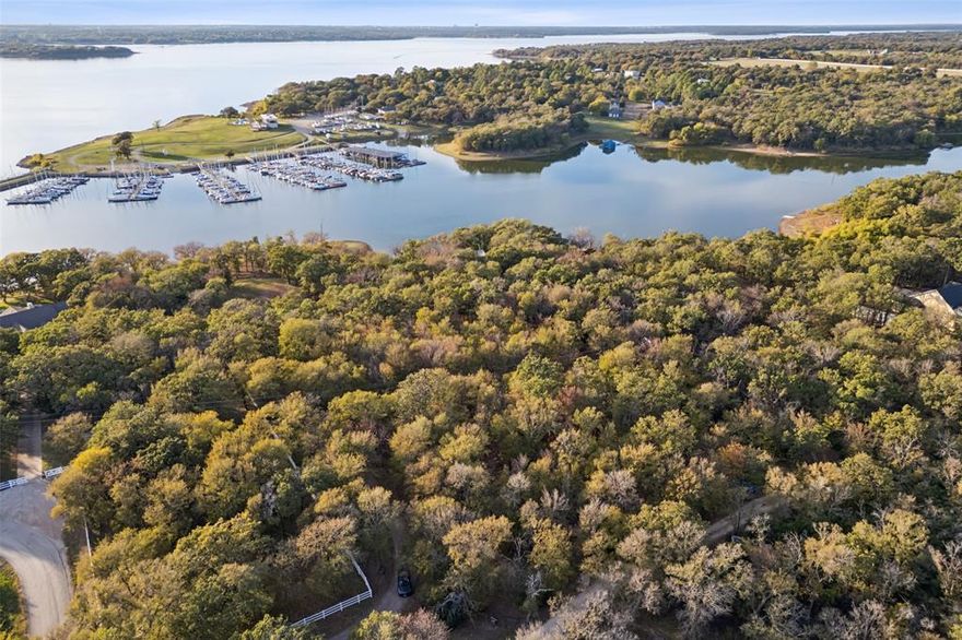 Welcome to 350 West Dickson Lane, a unique opportunity nestled in the heart of Oak Point, TX. This property offers two adjacent parcels (R156580 and R156581) offering dual elevated homesites with breathtaking views and over 400 feet of deep-water shoreline, making it a rare find for those seeking a serene waterfront lifestyle near the Dallas Corinthian Yacht Club.
Located in the City of Oak Point, this property benefits from favorable and flexible zoning (R3x), allowing for modern architectural designs with flat roofs and rooftop decks. Whether you're envisioning a contemporary masterpiece or a tranquil retreat, this site is cleared and ready for your vision.
Utilities are already in place with water, electricity, and septic onsite, ensuring a smooth transition from concept to creation. The location is both convenient and central, with just a 30-minute drive to Love Field, downtown Dallas, and DFW Airport, making it perfect for those who desire accessibility without sacrificing tranquility.
Oak Point is a growing and desirable area, surrounded by numerous new upscale subdivisions such as Gates at Water's Edge, Arbor Cove, and the newest Sanctuary Point. This vibrant community offers a blend of modern living and natural beauty, making it an ideal place to call home.
Don't miss the chance to be part of this thriving community and create your dream home on this exceptional property.