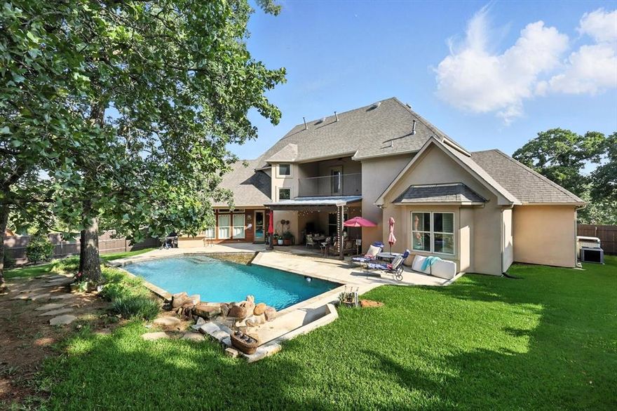 Unbelievable opportunity to own a custom built home in a vibrant Highland Village community. Sitting on a cul-de-sac, plenty of time left this year to enjoy the sparkling pool! Host family and friends outside with the beautiful covered patio and built in grill. This heavily treed lot is one of a kind! If you're looking for a house with lots of storage, this one will check that box. Every room is oversized with plenty of walk-in closet space. Primary and guest suites are both located downstairs. Beautifully styled dining and living rooms offer comfort and grace. You'll love the cedar beams and floor to ceiling fire place in the living room that overlooks the backyard. If you're looking for a functional kitchen, you're in luck! Commercial grade appliances will make cooking and hosting a dream. Double ovens, pot filler, gas cooktop, island, and butler's pantry. 3 car garage, new front windows, and gas lit lanterns in the front! Highly rated schools, top notch community amenities including lighted tennis courts, community center, park, basketball court, pool, walking trails and many activities.