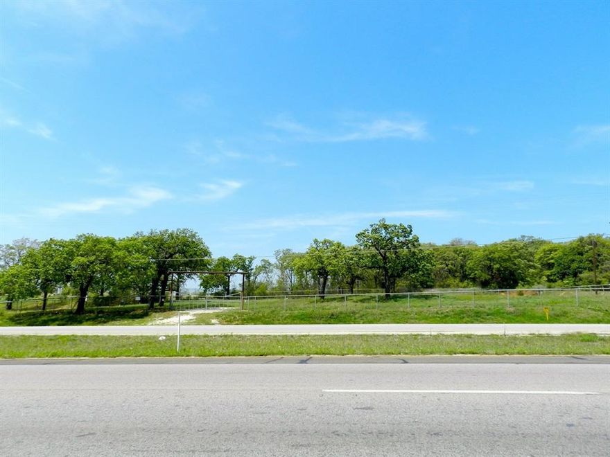 Prime Commercial Opportunity on Bustling Hwy 174 in Burleson! This beautifully wooded and level 0.67-acre lot boasts approximately 220 feet of road frontage on a high-traffic corridor with over 33,000 vehicles per day. Ideally positioned between major landmarks—QT, medical offices, a gym, an antique mall, storage facilities, restaurants, and a mega church (Northpoint Baptist)—this property offers unbeatable visibility and convenience.

The site is fully fenced and utility-ready with water (including hydrant), electric on-site, and a sewer tap located directly at the fence line on the southwest corner. Neighboring businesses include an auto parts store to the east and the church to the west, making this a high-footfall area with diverse consumer draw.

Zoned for commercial use, the lot is suitable for a wide range of developments: restaurant (with potential drive-thru), retail center, professional office space, or medical practice. With easy access and exceptional daily exposure, this location is ready to support your next venture.

Don’t miss this rare opportunity to build in one of Burleson’s most active and growing corridors!