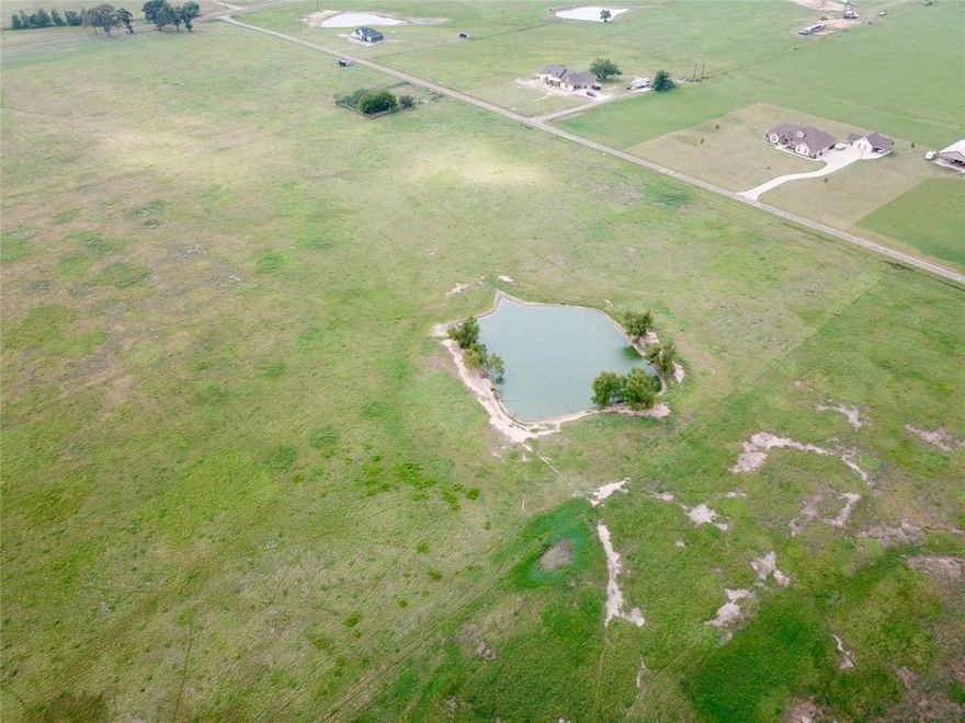Lot 9 is a 9.78 acre tract. Excellent location in the Martins Mill ISD. Clear pasture land with a nice pond ready to build your dream home. Restrictions. Well required.