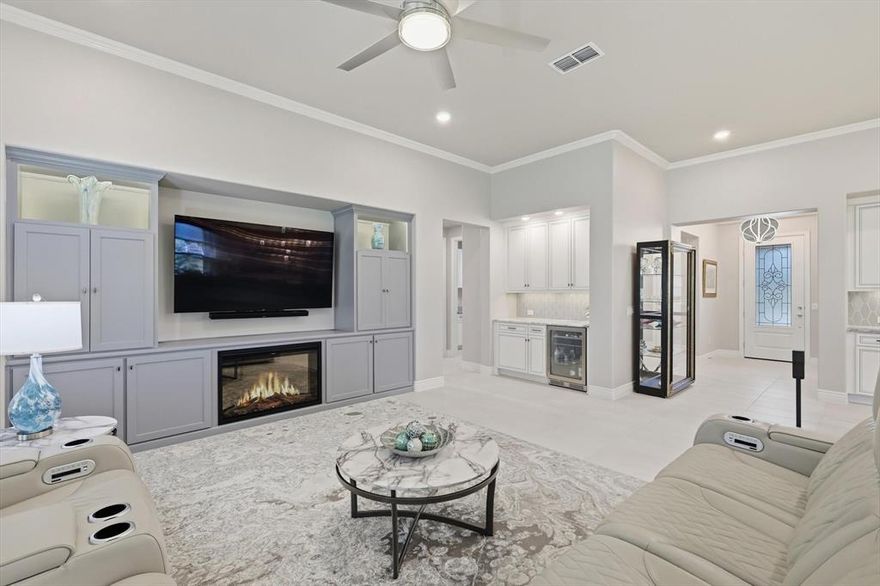 Discover this beautifully upgraded Larkspur model—better than new and ready for you! This thoughtfully designed home features 2 bedrooms, each with its own ensuite bath, plus a convenient half bath for guests. A versatile den and generously sized ( 21 x 9.5 ) hobby room give you all the space you need for work or play.  Throughout the home, you’ll find custom touches that truly set it apart. Rich woodwork frames the cozy, electric fireplace, while elegant Dolomite counters elevate the kitchen, dry bar, and primary bath. Remote-controlled shades in the living room and primary suite let you adjust the light with ease, and plantation shutters add timeless style to the guest bedroom, den, and hobby room.

Entertain effortlessly in the open-concept living area, complete with a dry bar and wine fridge—perfect for gatherings large or small. Step outside to an approximately 30' covered patio with full remote-controlled screens, pre-wired for a fan and TV, and an extra gas bib ready for your grill.

Ideally located near the Robson Ranch entrance and I-35W, you’ll have quick access to shopping, dining, and all the amenities of this vibrant active adult community—including golf, tennis, pickleball, bocce ball, a fitness center, indoor and lagoon pools, plus countless clubs and activities.

This home is loaded with upgrades and ready to welcome you. Come see it today and start your next adventure at Robson Ranch!   * All information is deemed reliable but is not guaranteed and should be independently verified *