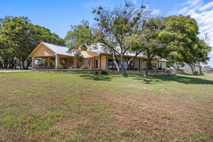 242 acres of picturesque ranch land in Hamilton County, Texas, just outside Pottsville. This stunning property features rolling terrain with scattered oak trees, native grasses, and two large tanks, making it perfect for ranching or recreation. A classic barn with cattle pens adds to the ranch's charm. The property's highlight is a custom-built, ranch-style home offering 3,166 sq. ft. of living space, including 3 bedrooms and 3.5 baths. The spacious living room, with its cozy fireplace, wood beams, and hardwood floors, opens to a large kitchen with granite countertops, ample storage, a gas range, double ovens, and a flat-screen TV for added entertainment. A breakfast nook completes the kitchen's welcoming feel. Additional features include a home office, a mudroom off the carport, a sizable laundry room, and abundant storage. Each guest bedroom has its en-suite bathroom for added comfort, while the primary suite offers ranch views and an expansive bath with a soaking tub, separate shower, and a walk-in closet. Enjoy the outdoors with generous porches off the living room and kitchen, perfect for taking in the scenic beauty of the ranch. The property also includes a large shop with equipment overhang and a guest apartment for convenience.